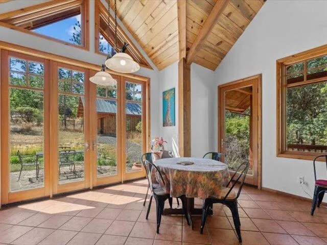 a view of living room with furniture and potted plants
