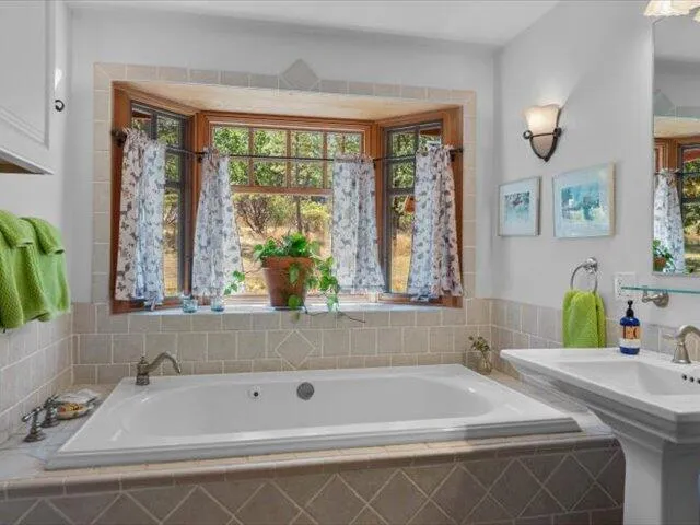 a view of a porch with wooden floor and outdoor space