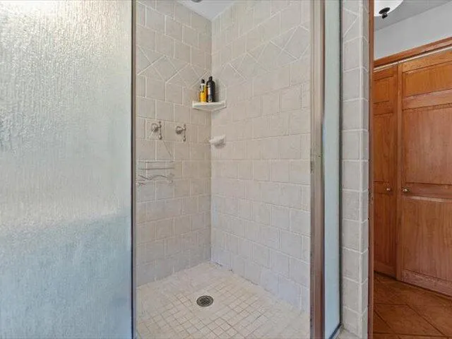 a porch with wooden floor in front of a house