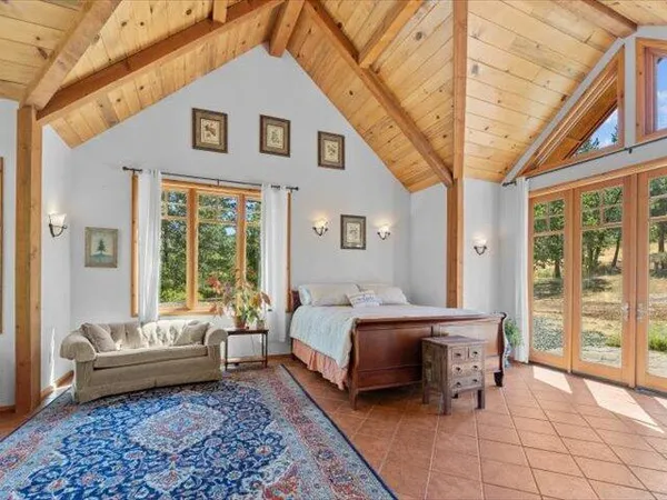 a view of a livingroom with furniture and a window