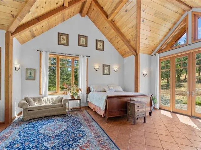 a view of a livingroom with furniture and a window