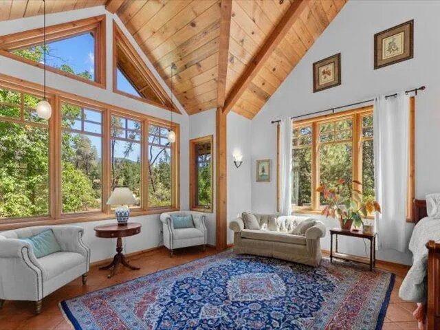 a view of an empty room with floor to ceiling window and walk in closet