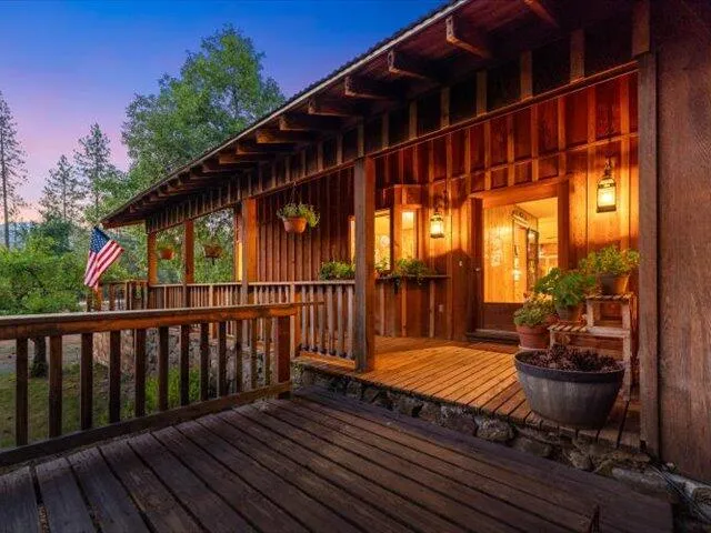 a view of a house with a yard and sitting area