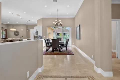 a kitchen with stainless steel appliances granite countertop a stove and a refrigerator