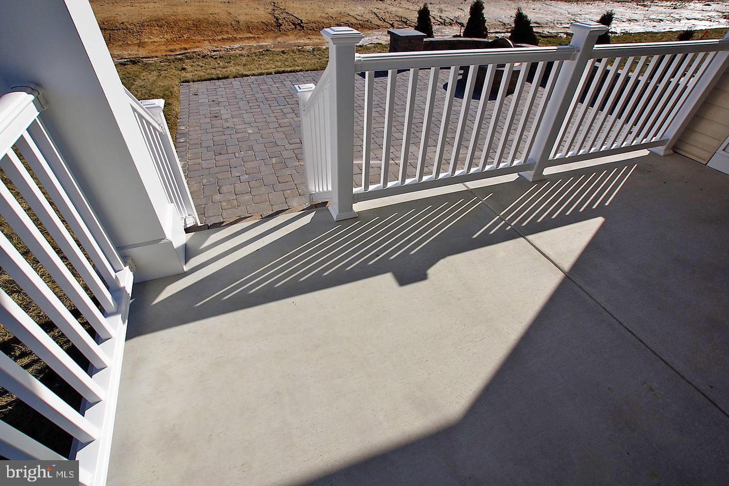 1058 Robinson Road, Unit LAKELAND Townsend, DE 19734 - Photo 32 of 32 Backyard porch steps to patio