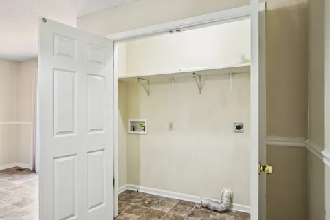 a bathroom with a granite countertop shower and a toilet