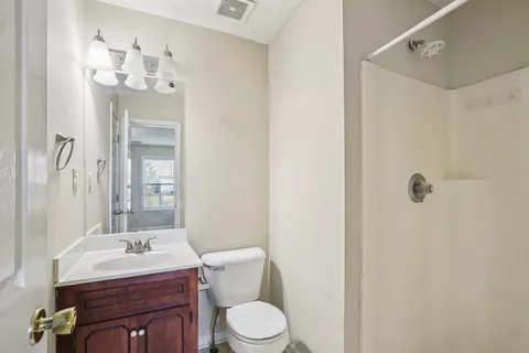 a view of a room with wooden floor