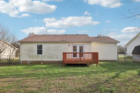 a view of a backyard with plants and a garden