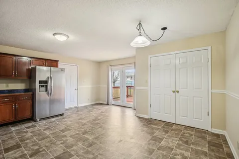 a view of a kitchen with a sink and stainless steel appliances