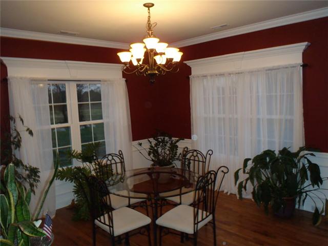 7779 Lowe Road Christiana, TN 37037 - Photo 11 of 20 Dining area off kitchen.. Notice all the custom mouldings above every window and doorframe