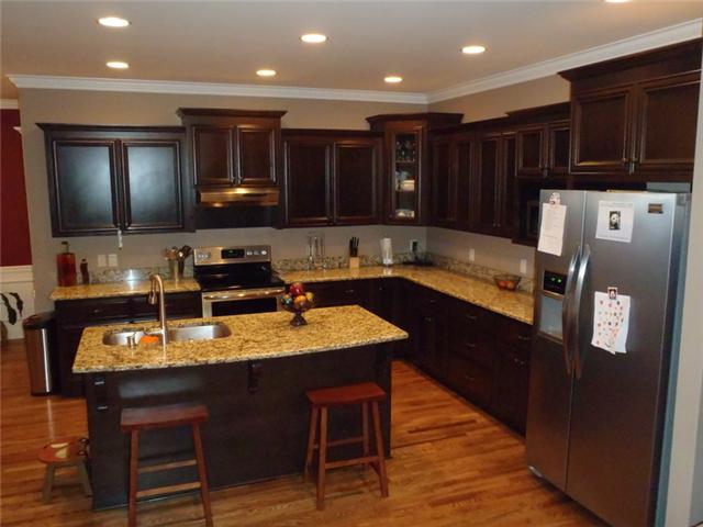 7779 Lowe Road Christiana, TN 37037 - Photo 8 of 20 Custom kitchen with granite countertops, bar island with sink and very open and livable layout.. Recessed can lighting is everywhere..