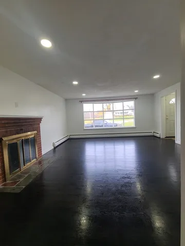 a large kitchen with large cabinets and stainless steel appliances