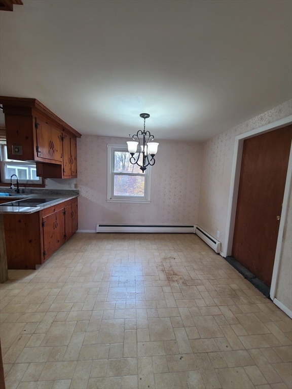 1669 Main Street, Unit A Leicester, MA 01524 - Photo 7 of 7 a view of a kitchen with a sink cabinets and a window