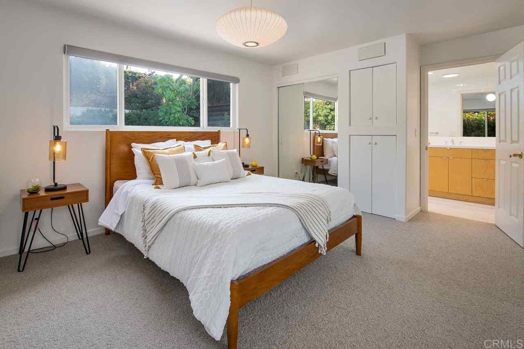 405 9th Street Del Mar, CA 92014 - Photo 12 of 25 a bed sitting in a spacious bedroom next to a window