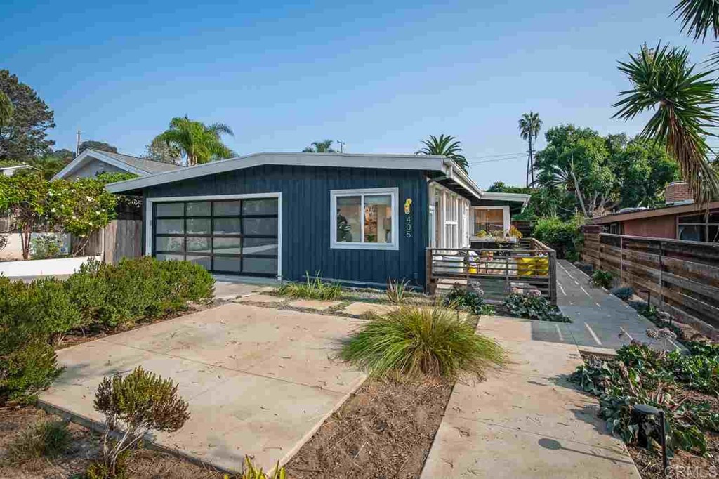 405 9th Street Del Mar, CA 92014 - Photo 2 of 25 a front view of a house with a yard
