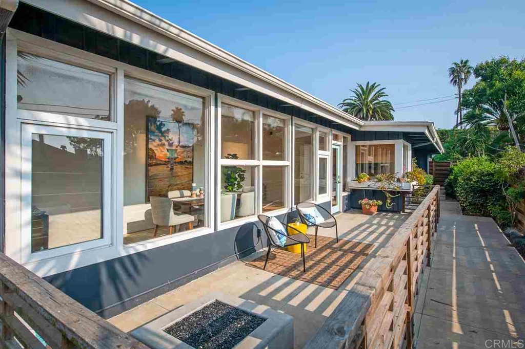 405 9th Street Del Mar, CA 92014 - Photo 23 of 25 a view of a patio with couches table and chairs and potted plants