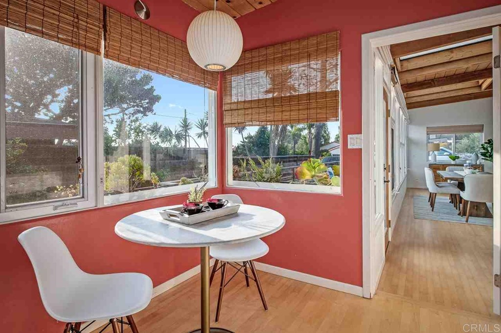 405 9th Street Del Mar, CA 92014 - Photo 9 of 25 a view of a dining room with furniture wooden floor and a chandelier
