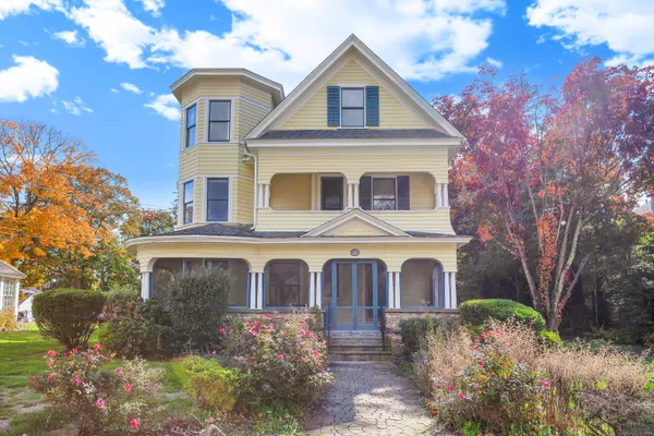 a front view of a house with garden