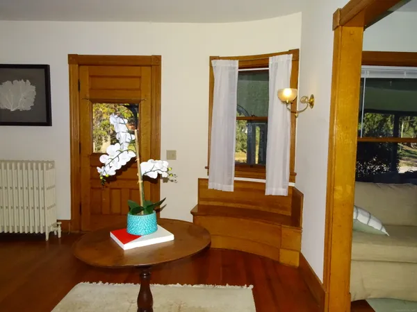 a dining room with furniture and window