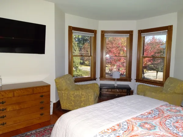 a view of a dining room with furniture and chandelier