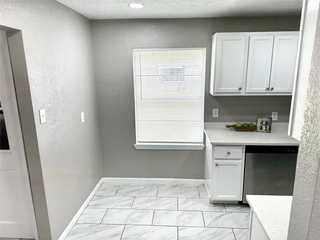 a bathroom with a sink vanity and a mirror