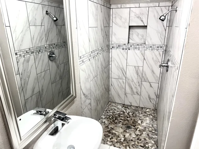a bathroom with a sink and a shower curtain