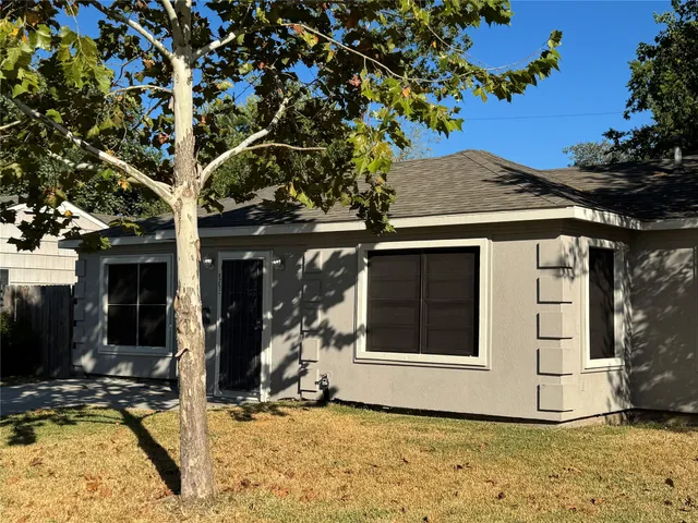 a house with trees in front of it