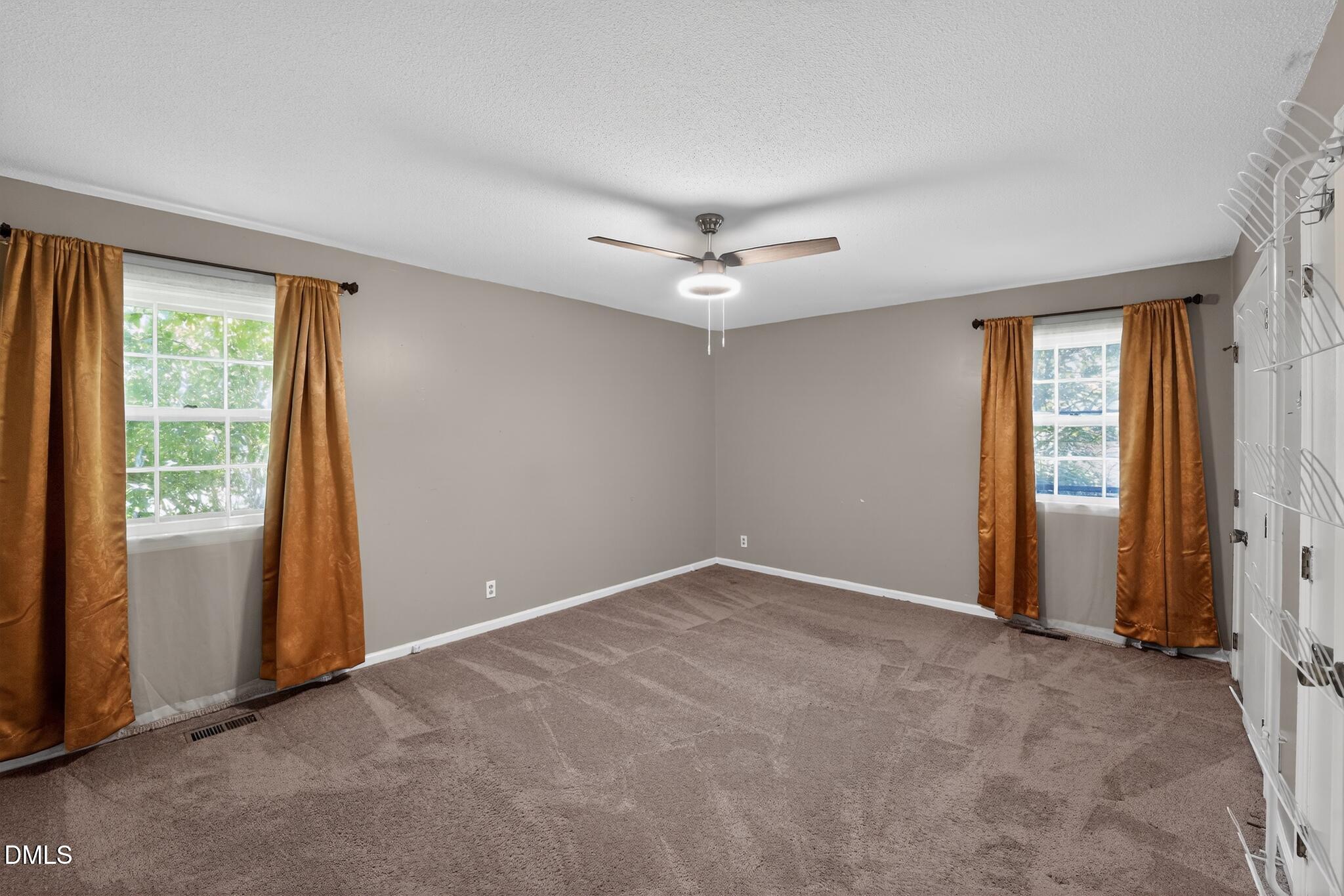 1034 Jerome Road Durham, NC 27713 - Photo 14 of 35 an empty room with windows and closet
