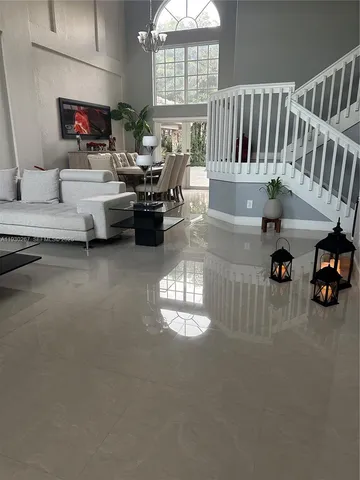 a living room with furniture and a flat screen tv