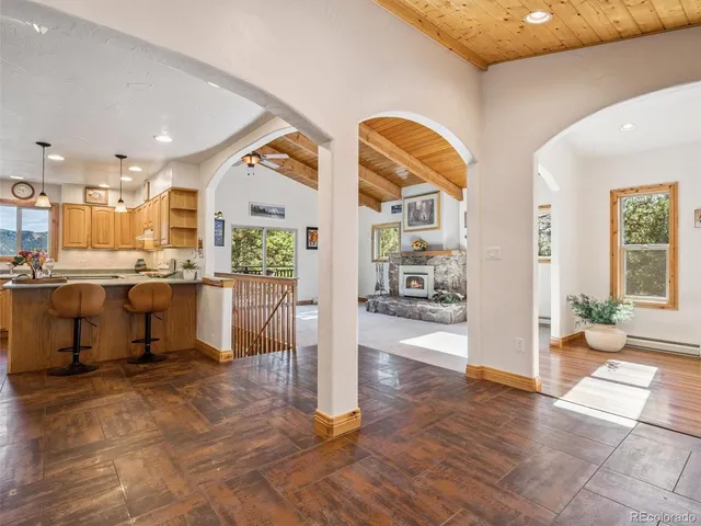 a view of a living room and kitchen view