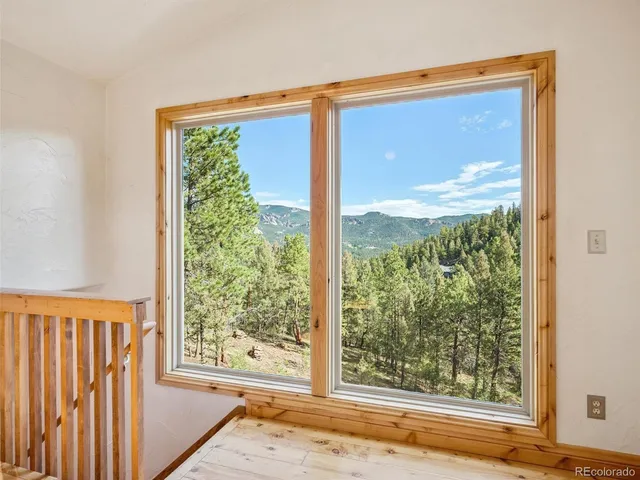 a view of a room that has a large window