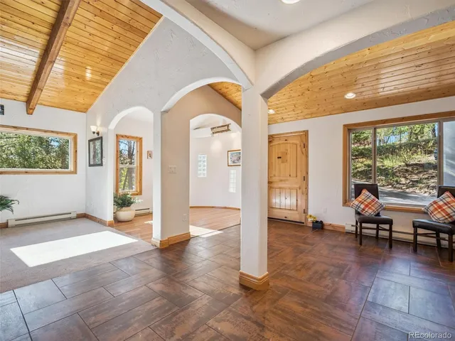 a view of livingroom with furniture wooden floor and windows