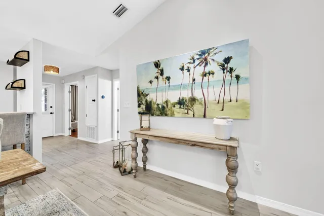 a living room with furniture and a table