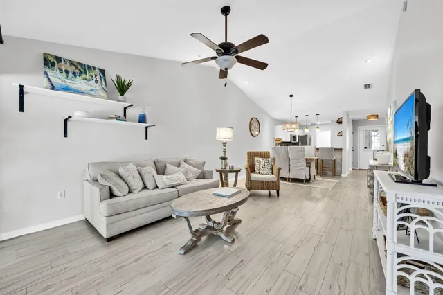a kitchen with stainless steel appliances a refrigerator sink and cabinets