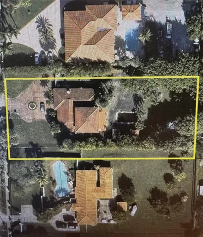 an aerial view of a house with a lake view