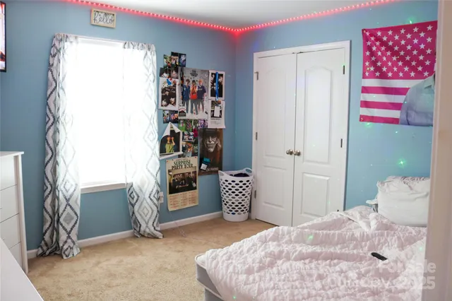 a room with a window and dresser