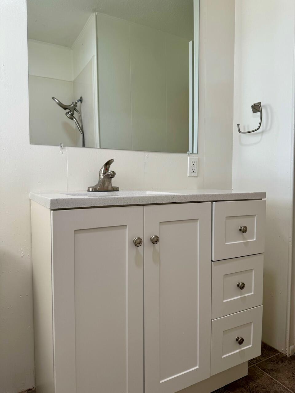 4001 32nd Street Lubbock, TX 79410 - Photo 14 of 21 a bathroom with a sink and mirror