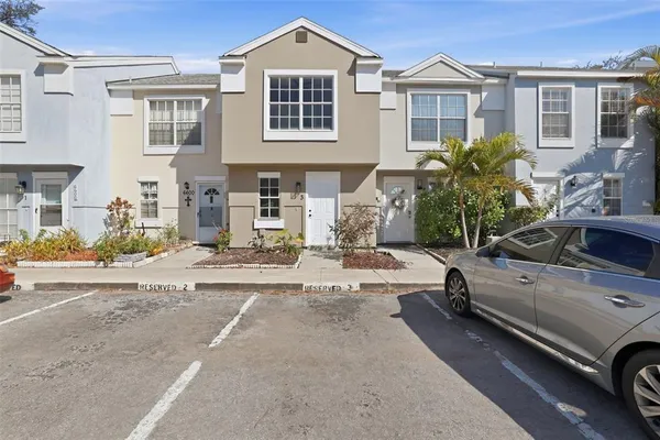 a view of a car park in front of a house