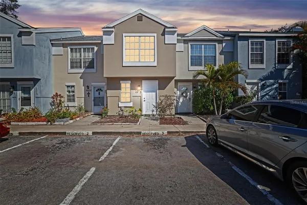 a view of a car park in front of a house