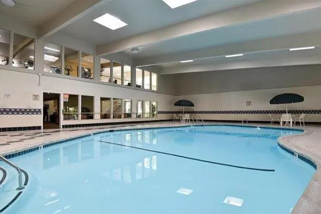 a kitchen with a sink and a stove top oven