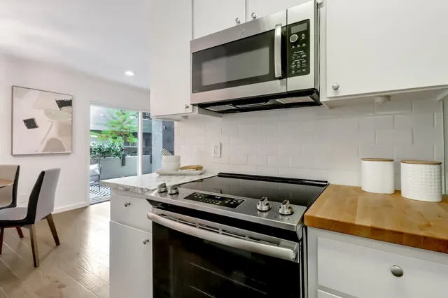 a kitchen with a stove and a microwave