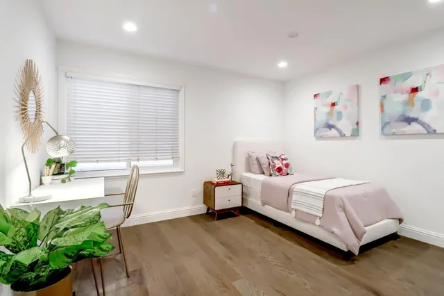 a room with a bed and a window