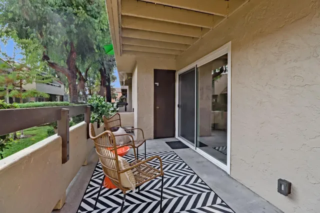 a view of balcony with furniture