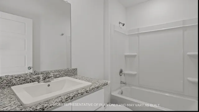 a bathroom with a bathtub and shower