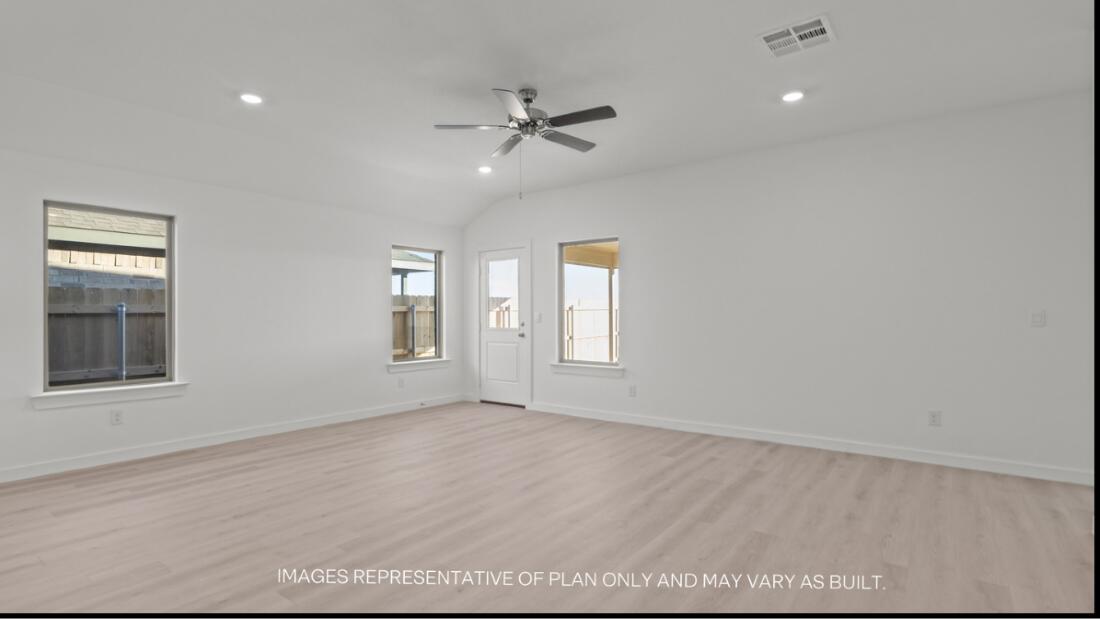 2303 150th Place Lubbock, TX 79423 - Photo 8 of 19 a view of an empty room with a window