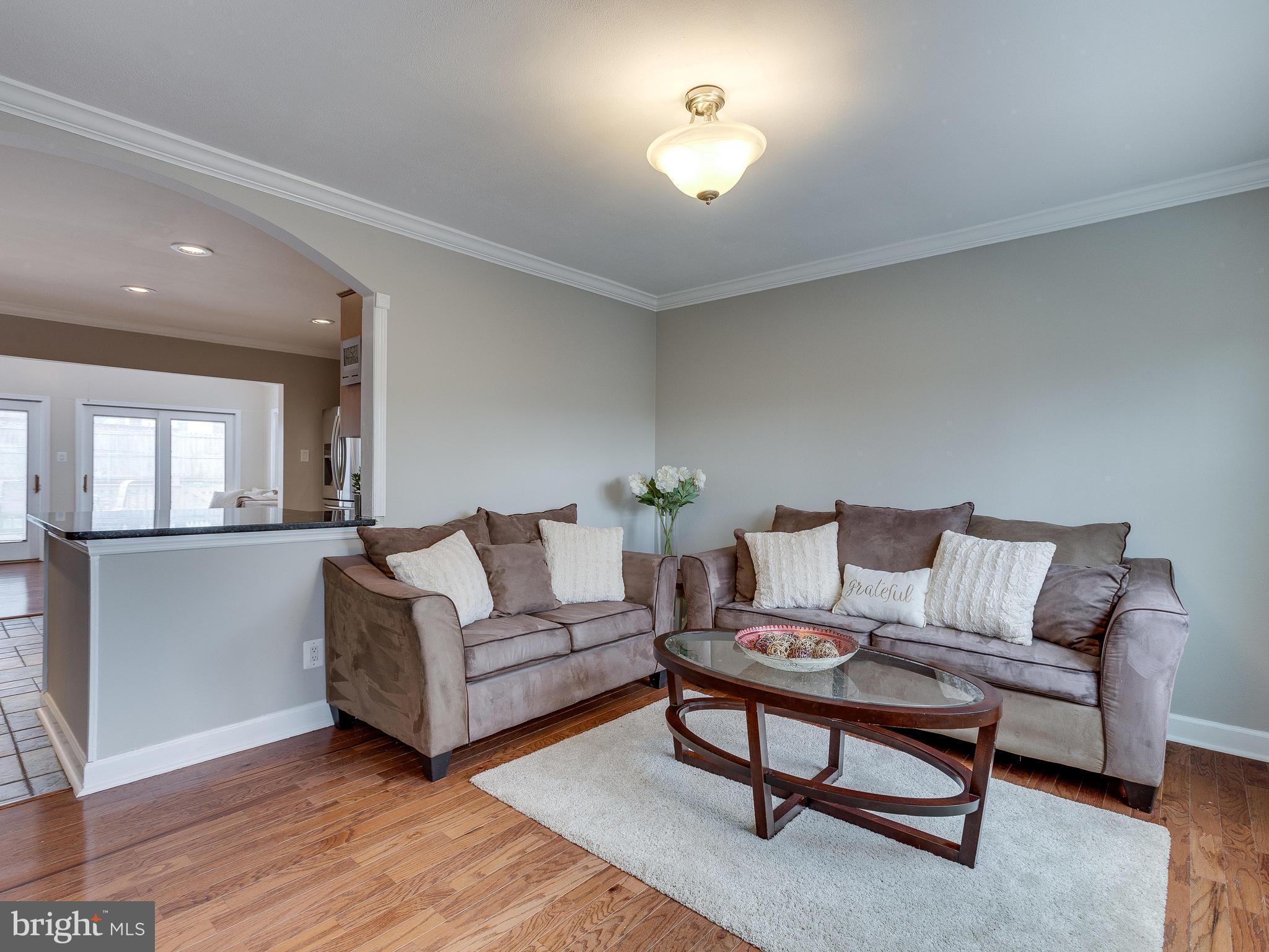 628 Beech Road Sterling, VA 20164 - Photo 2 of 30 Living Room w/ Crown Molding + Newer Hardwoods
