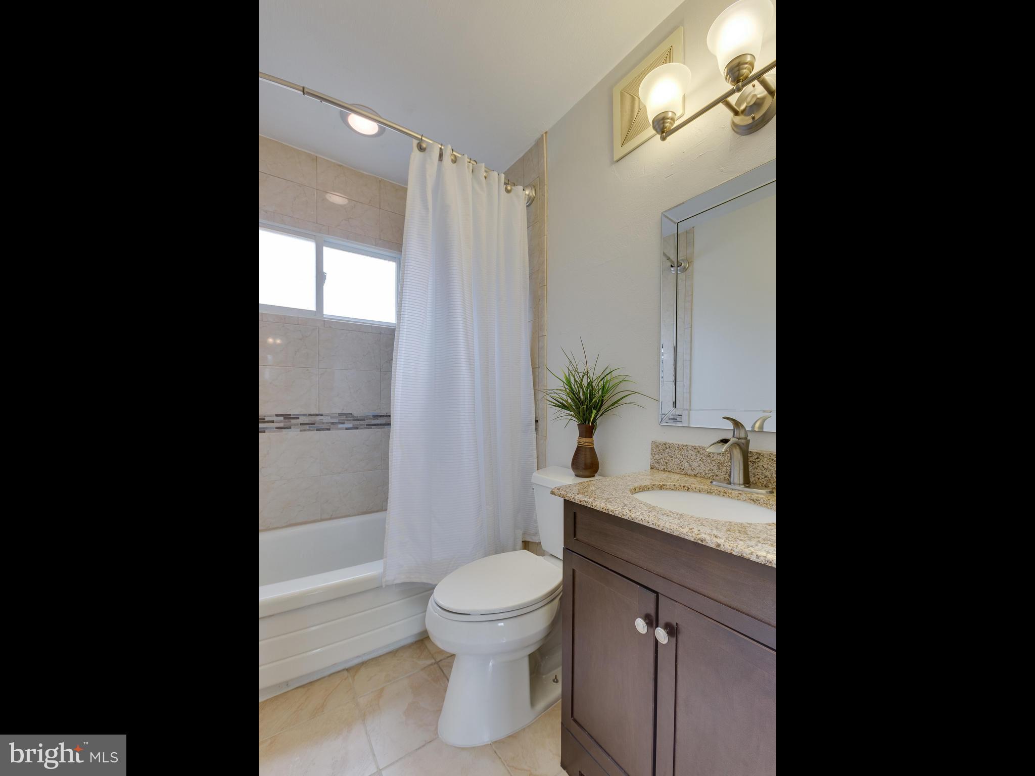 628 Beech Road Sterling, VA 20164 - Photo 14 of 30 Gorgeous Updated Hall Bath w/ Granite, Custom Tile