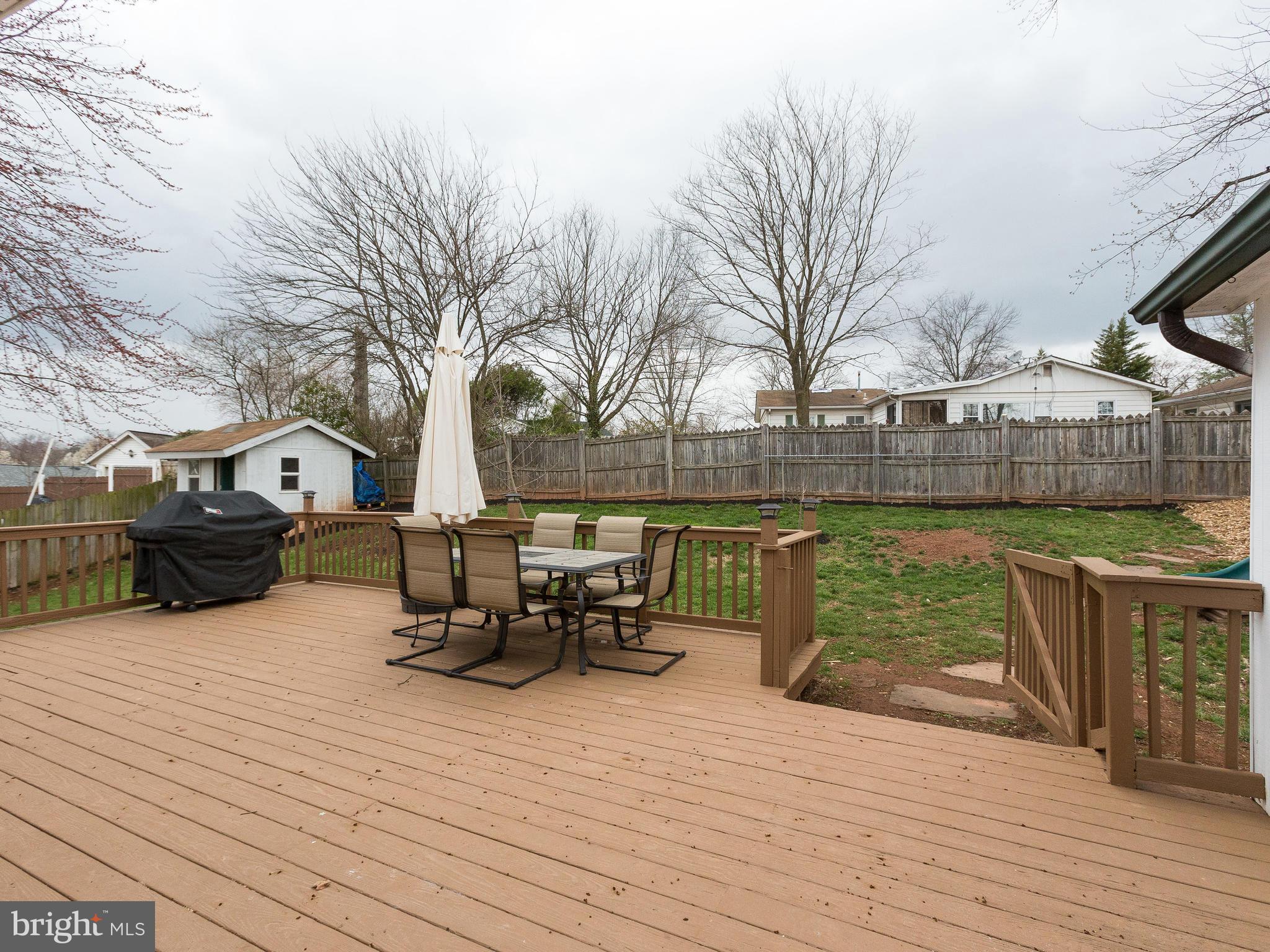 628 Beech Road Sterling, VA 20164 - Photo 20 of 30 Expansive Wood Deck leads to Fenced Rear Yard
