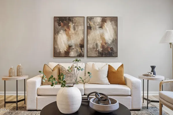 a living room with furniture and a lamp