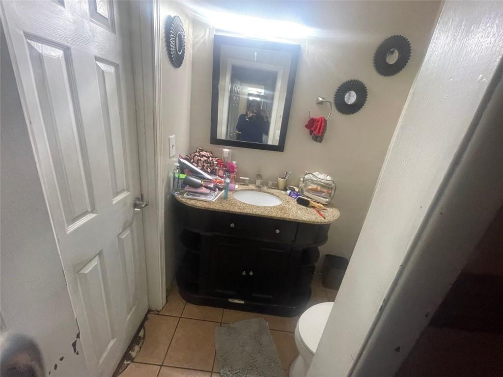 4015 Bakers Ferry Road Southwest Atlanta, GA 30331 - Photo 6 of 7 a bathroom with a sink vanity and mirror